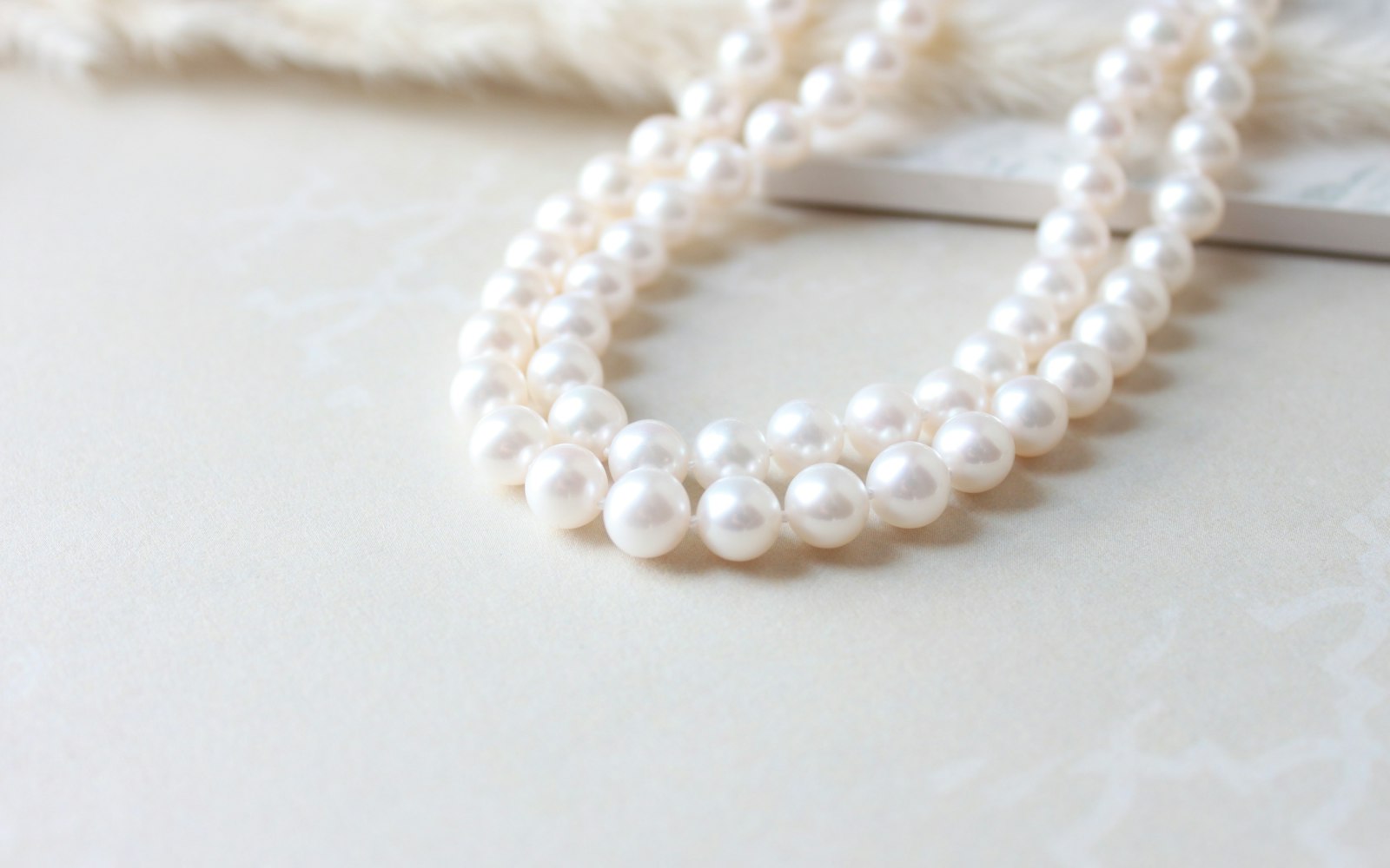 Close-up of a white pearl strand necklace